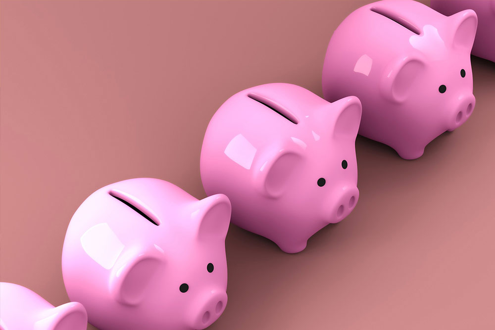 Three bright pink ceramic piggy banks on a pink backdrop, illustrating Profit Runner helping you understand your Amazon business finance.