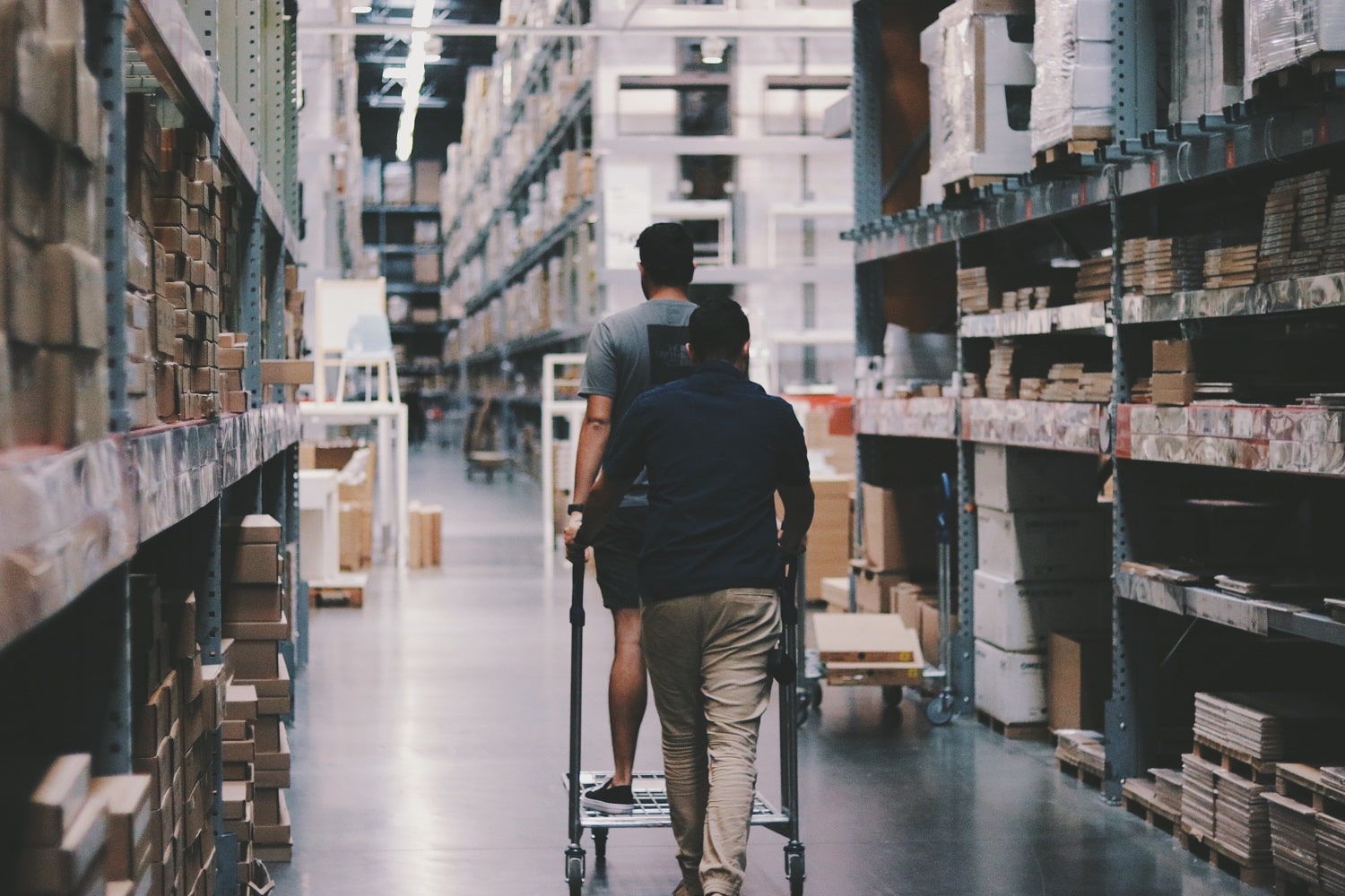 Two warehouse workers at an Amazon  centre.