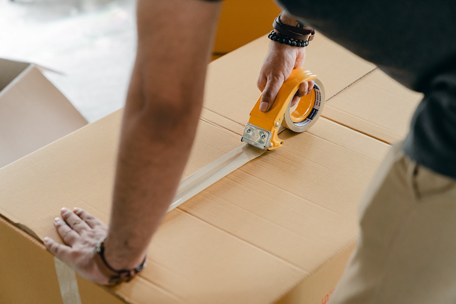 A seller getting ready to send stock to Amazon by prepping an Amazon shipment.